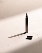 Black Tsubota Pearl Queue stick lighter with cap removed