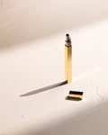 Gold Tsubota Pearl Queue stick lighter with cap removed