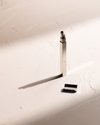Silver Tsubota Pearl Queue stick lighter with cap removed