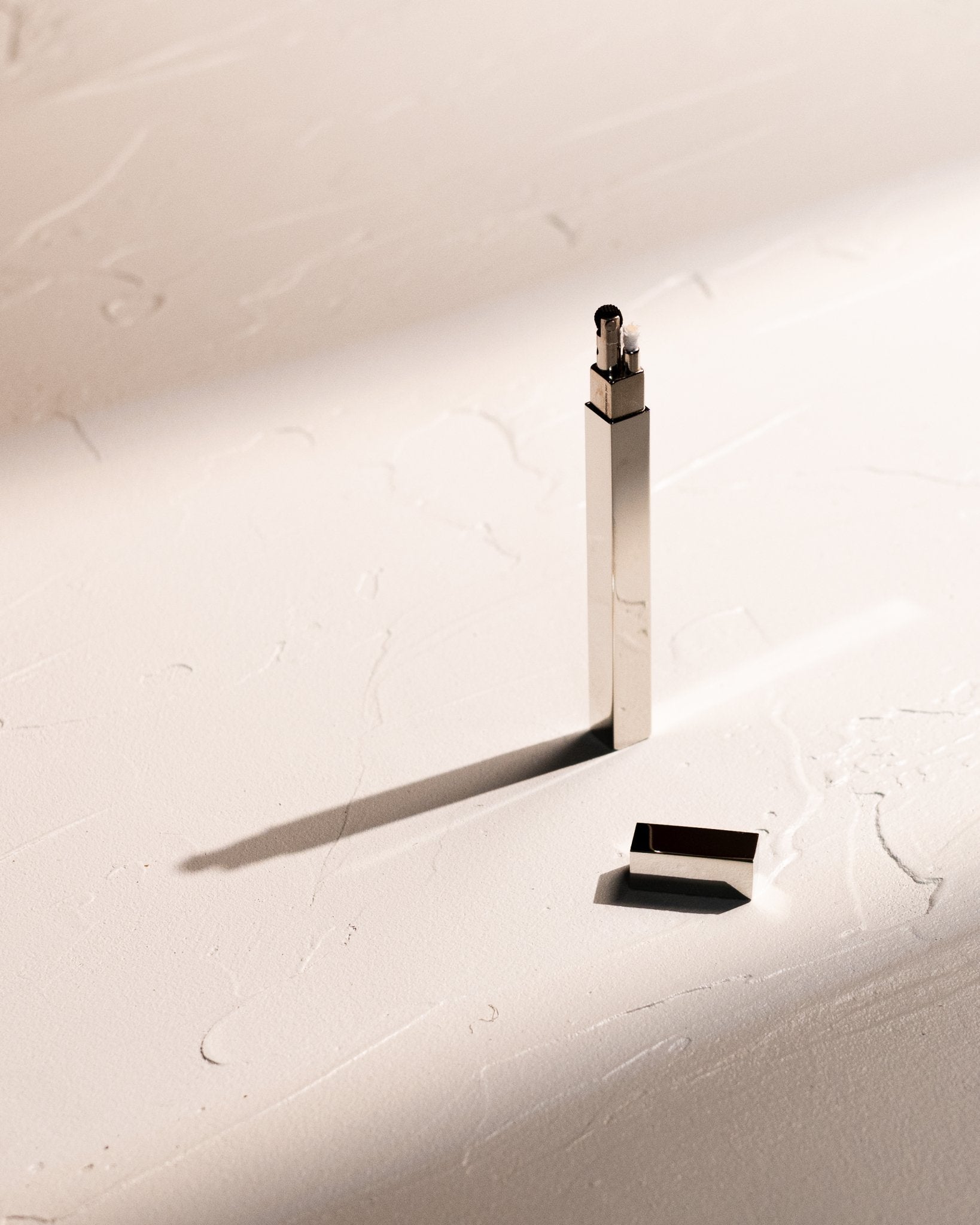 Silver Tsubota Pearl Queue stick lighter with cap removed