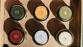 Winter Discovery Sample Pack tins shown together from above, displaying all included scents.