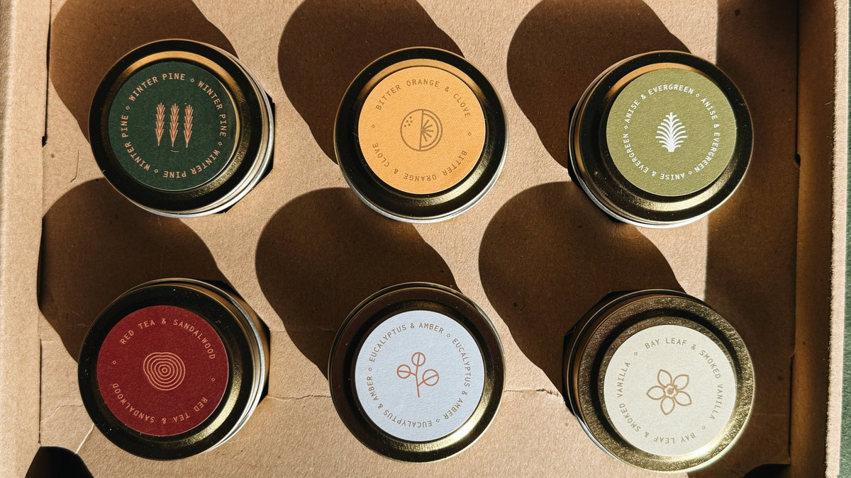 Winter Discovery Sample Pack tins shown together from above, displaying all included scents.