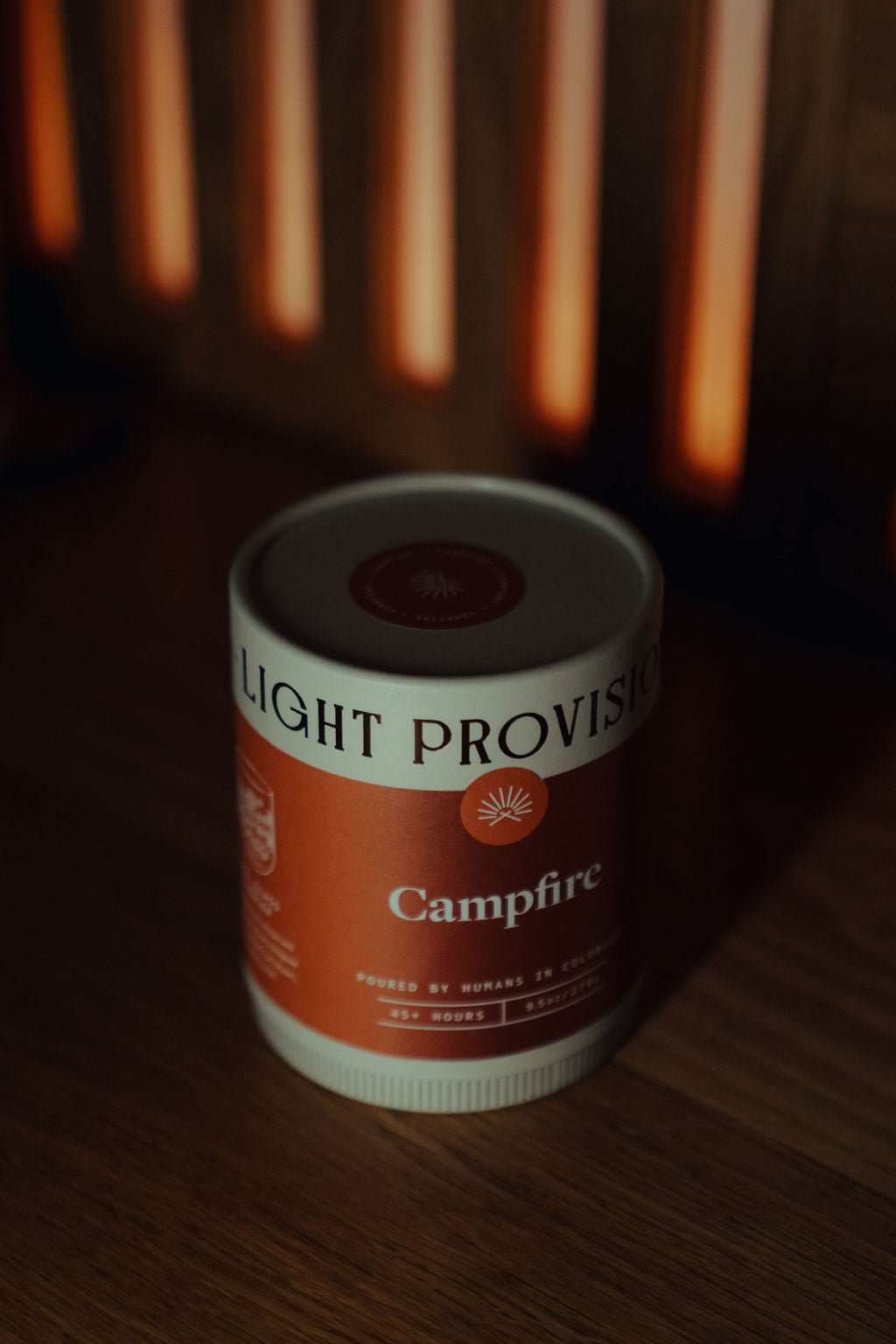 Campfire Candle in 9.5 oz ribbed glass tumbler with brown label on wood surface