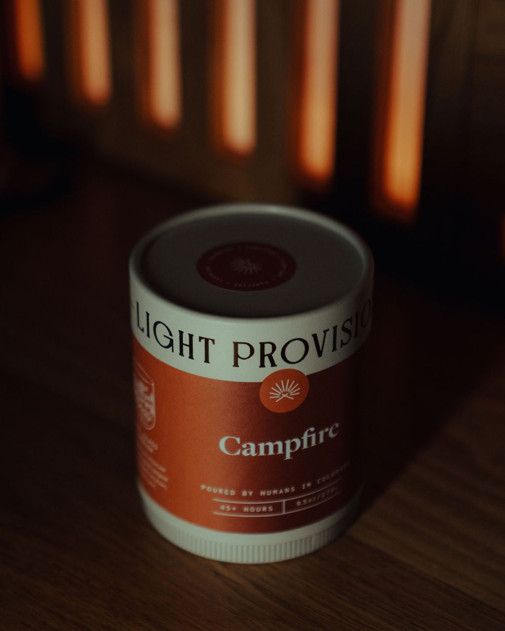 Campfire Candle in 9.5 oz ribbed glass tumbler with brown label on wood surface