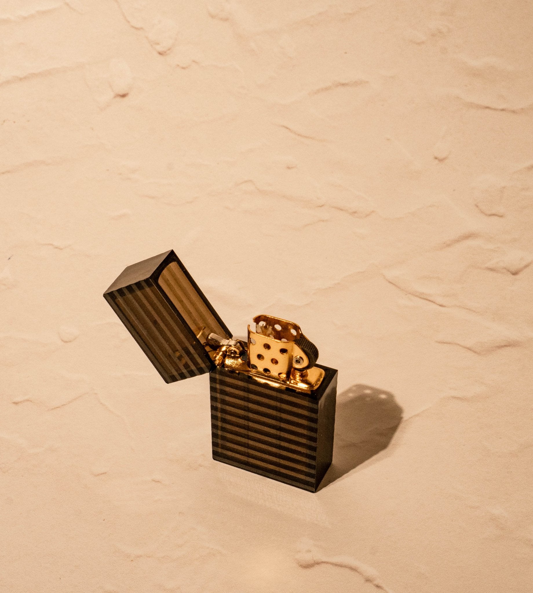 Latitude Hard-edge Lighter by Tsubota Pearl in ridged pattern, open with lid up, made in Japan