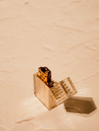 Clear Latitude lighter with open cap and gold interior body