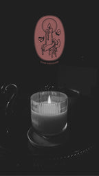 Moody lit candle graphic in black and white with moth graphic